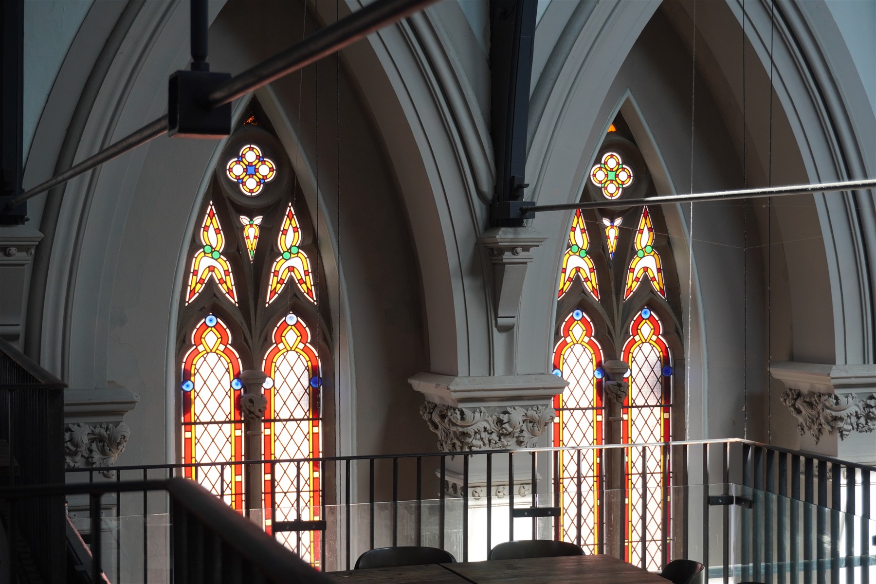 Arches, carved stone columns and stained-glass windows inside the restaurant building