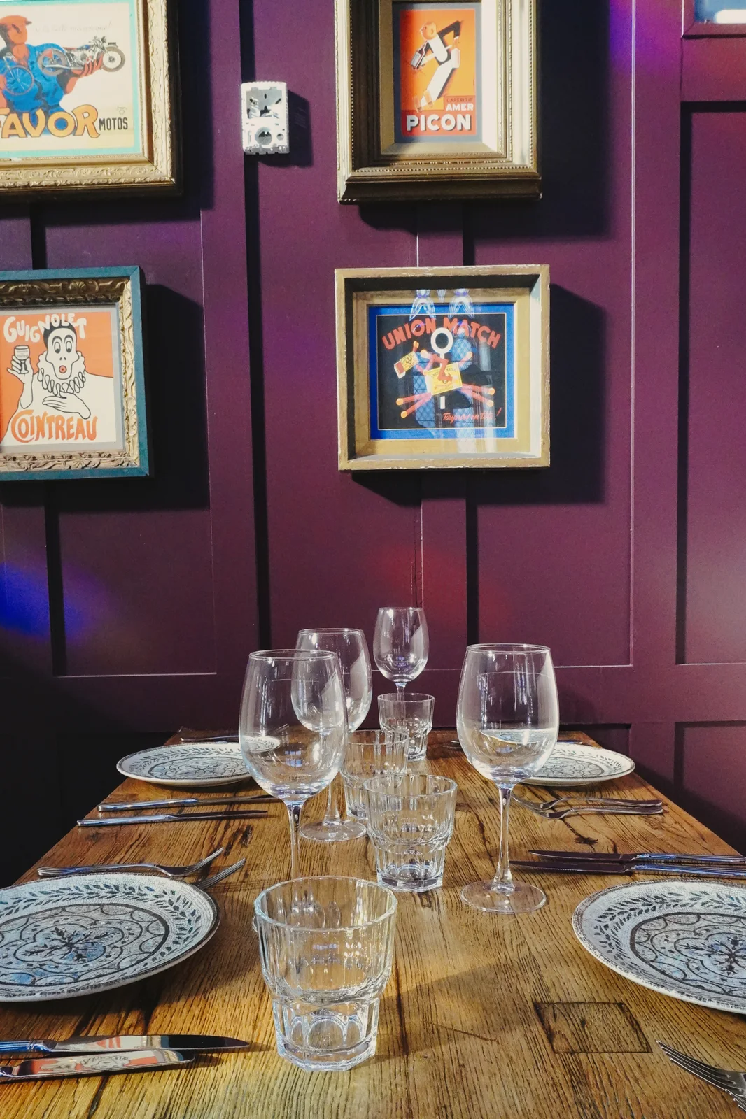 Framed artwork and pendant lighting in the dining room