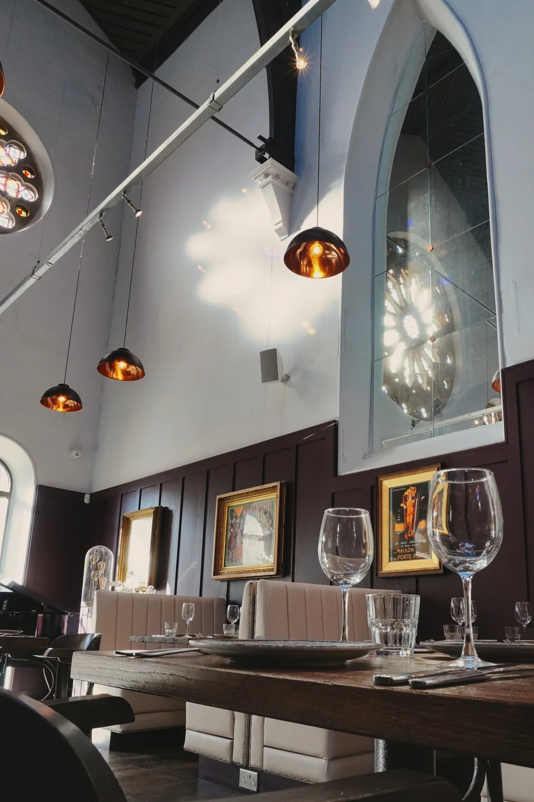 Framed artwork and pendant lighting in the dining room