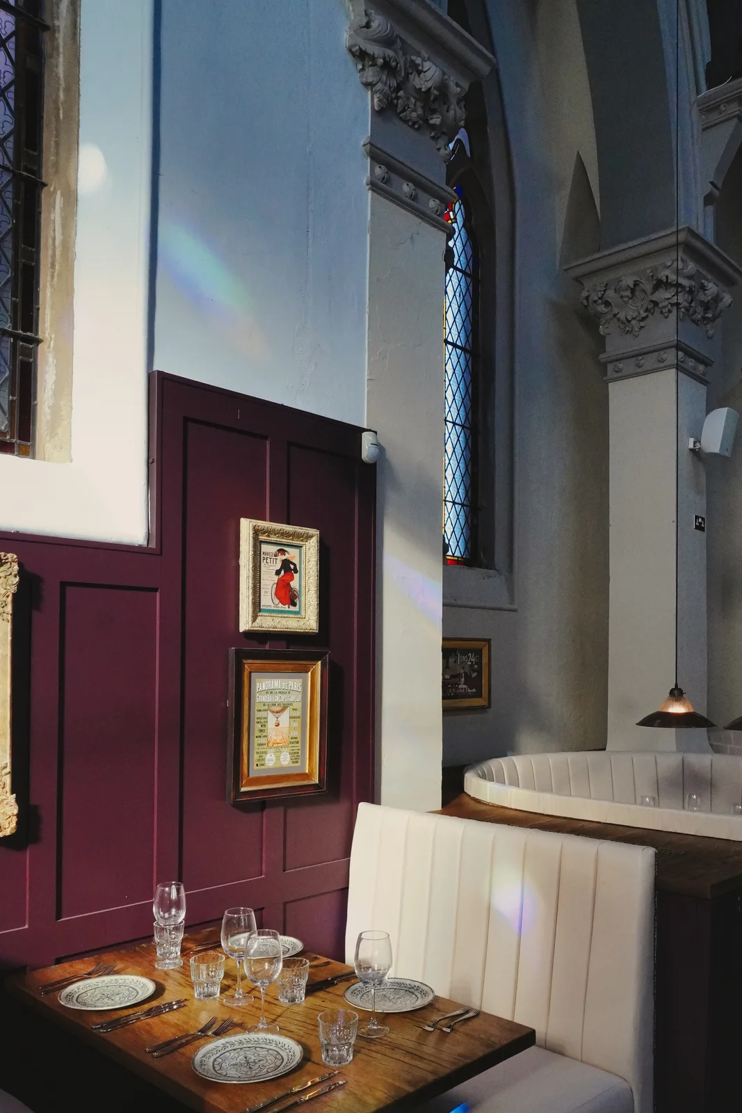 Framed artwork and pendant lighting in the dining room