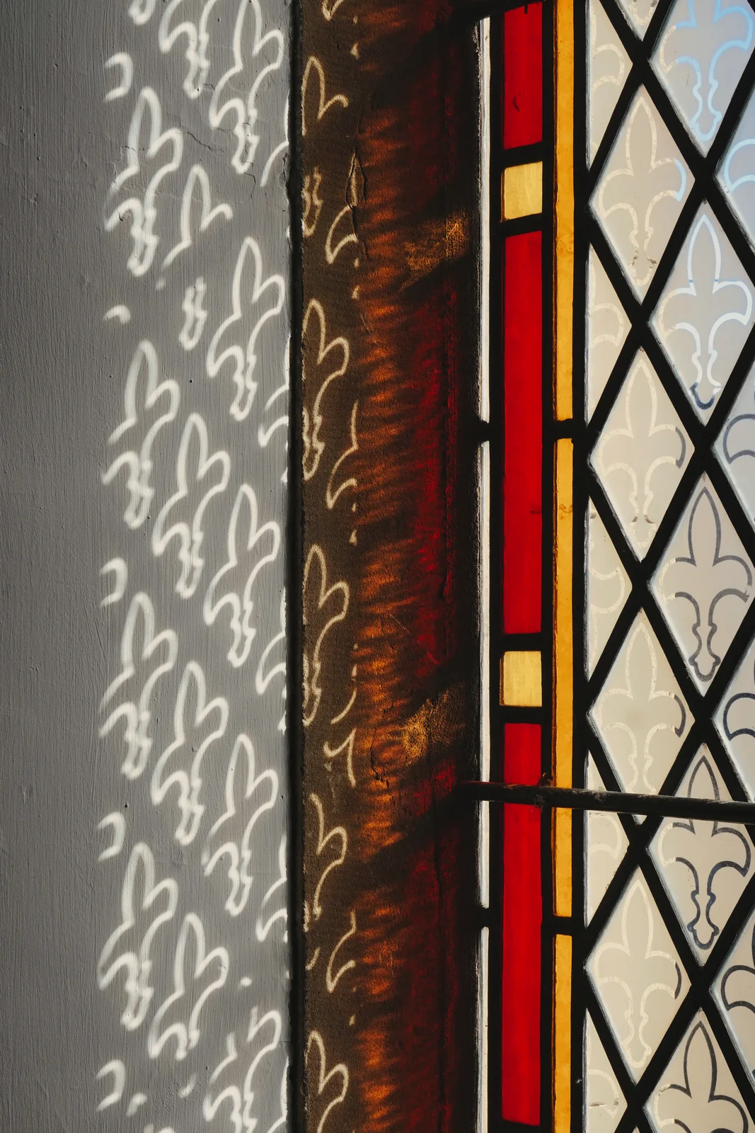 Sunlight through a leaded stained-glass window