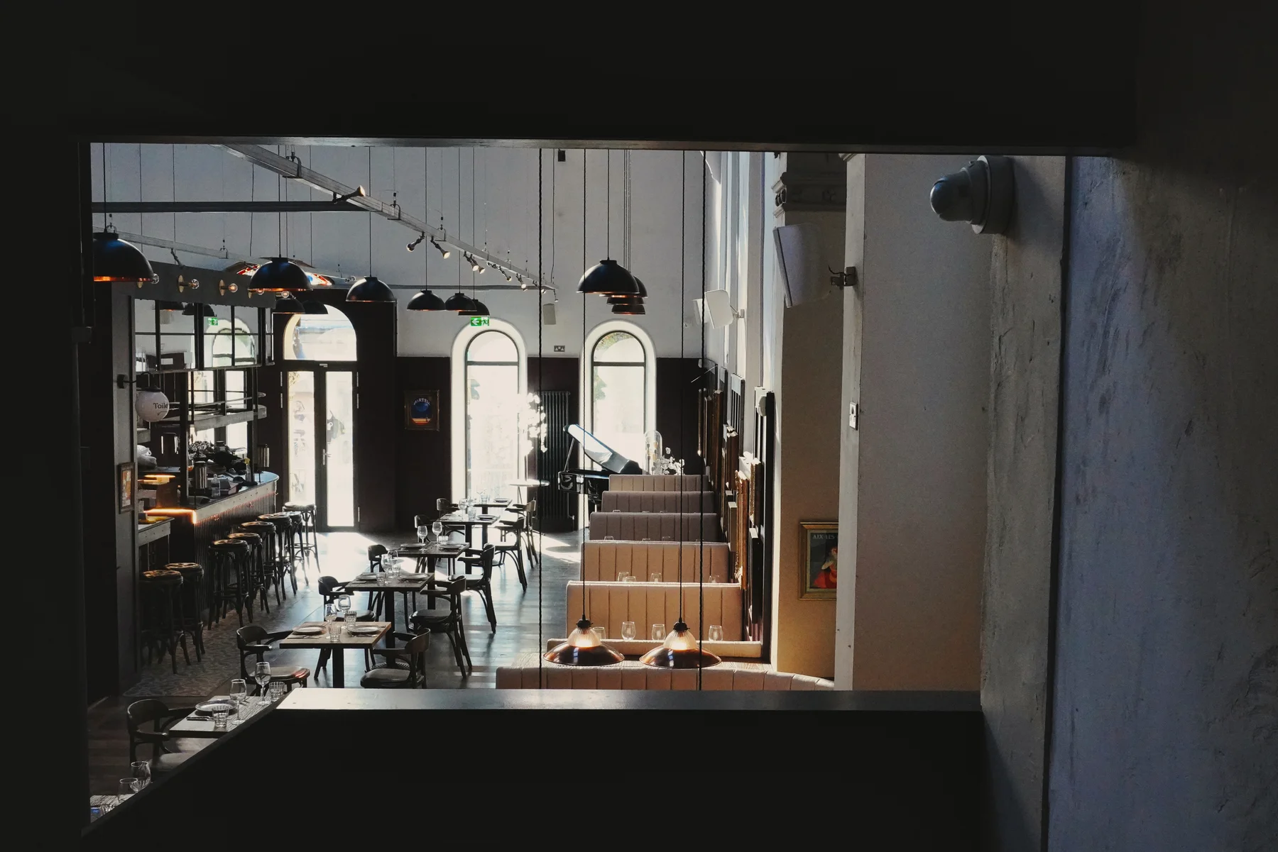 Dining tables beneath the church rose window