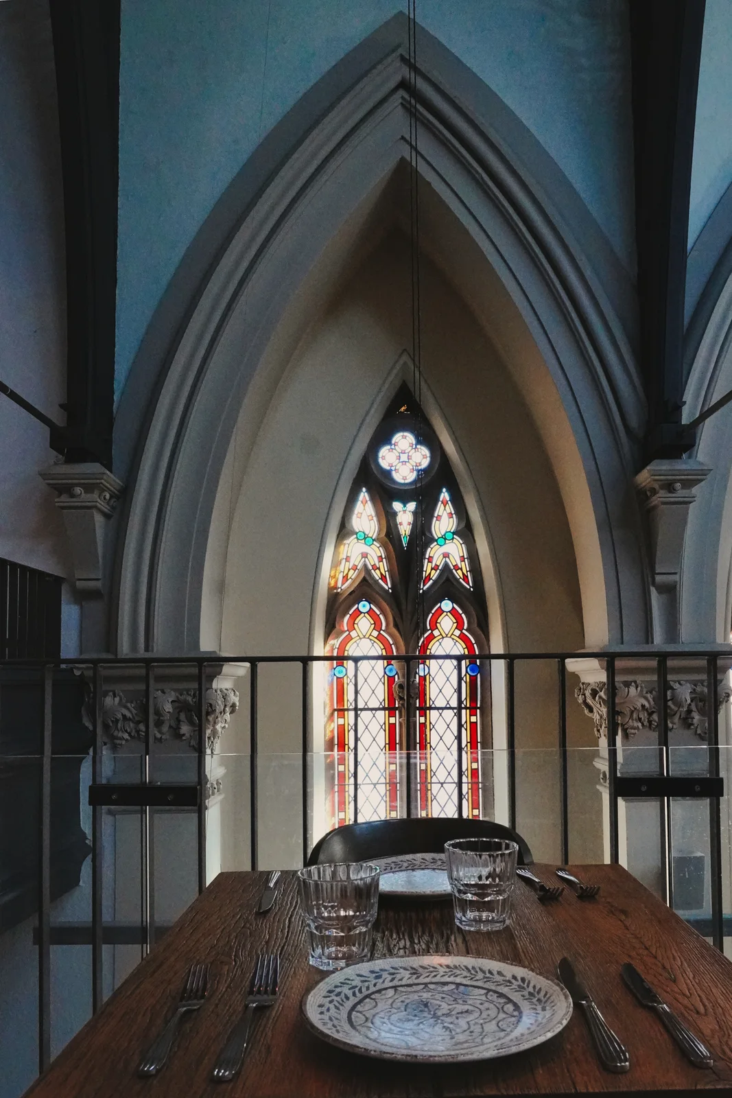 Upstairs tables and soaring stone window arches