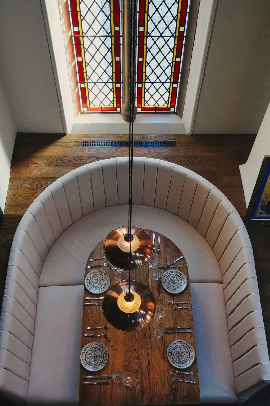 A curved dining booth viewed from above