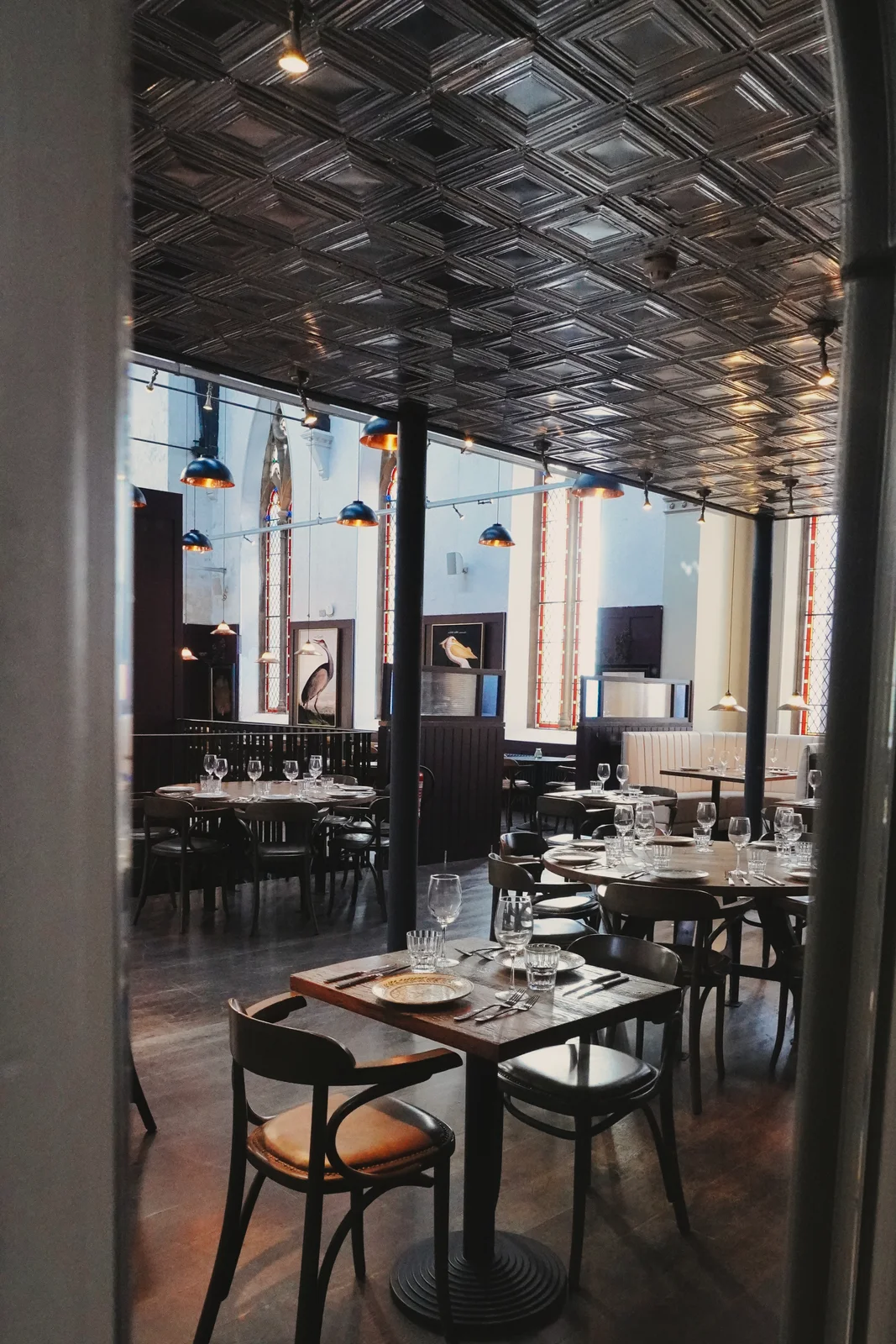 A glimpse of dining tables through the interior