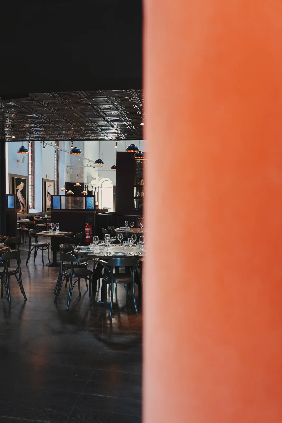 A glimpse of dining tables through the interior