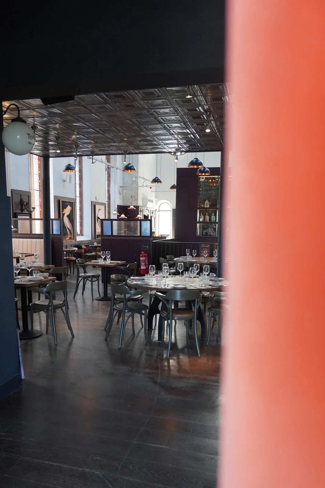 A glimpse of dining tables through the interior