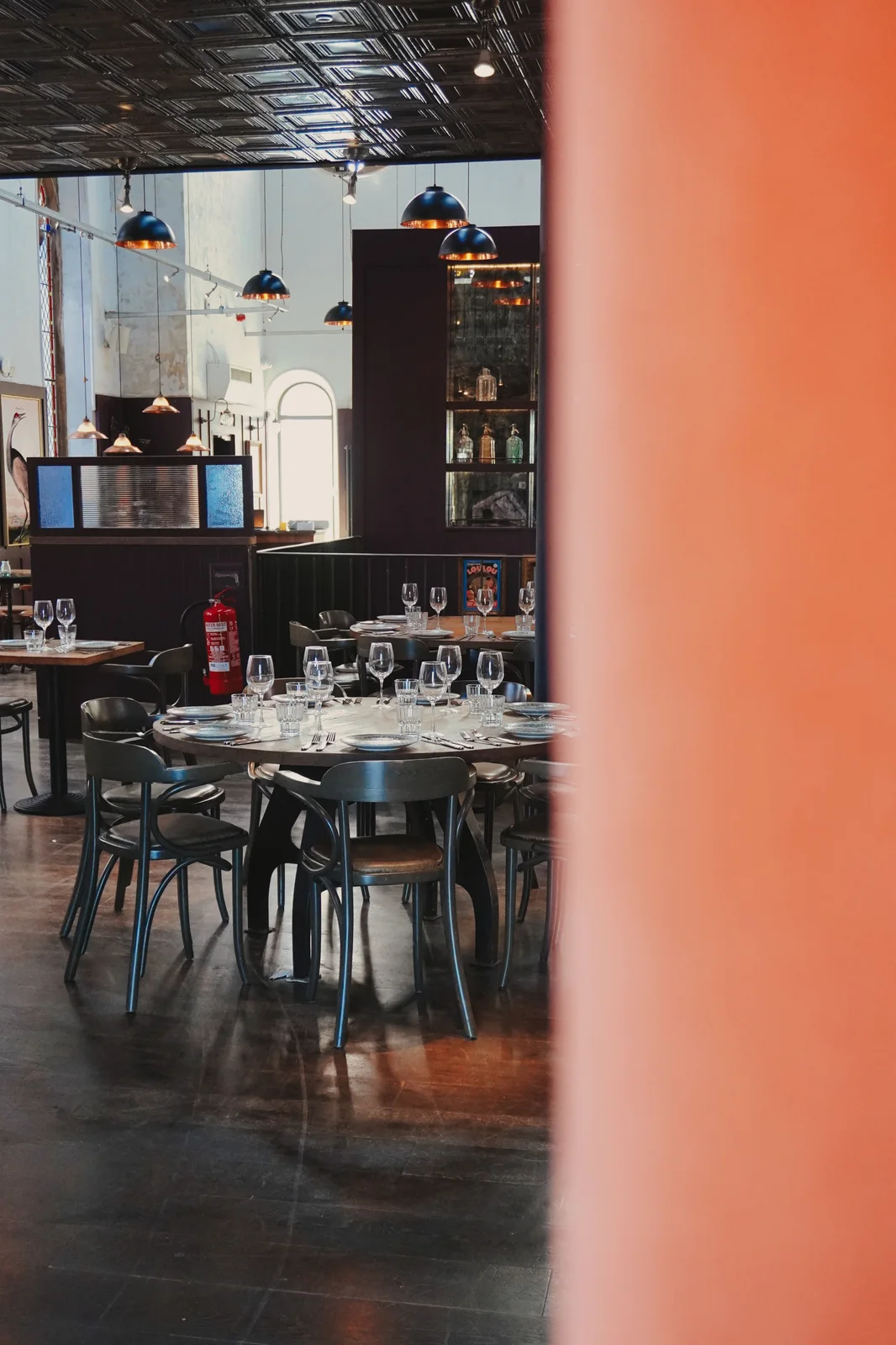 A glimpse of dining tables through the interior