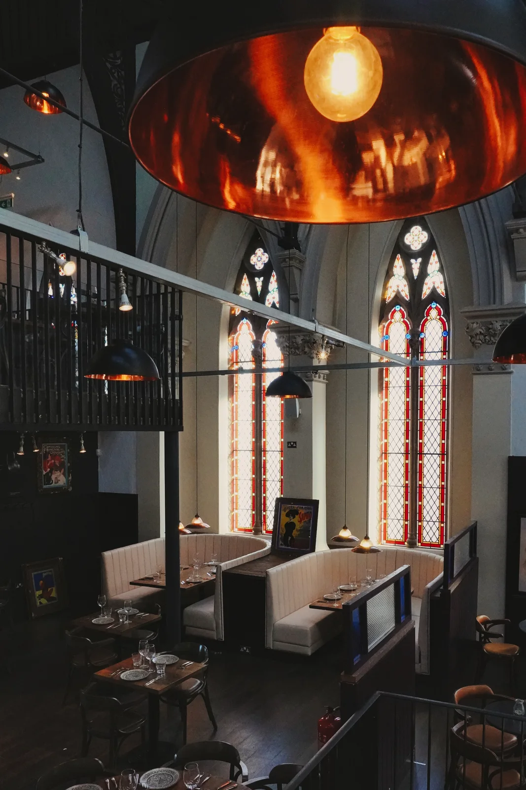 Copper pendant lights and stained-glass windows