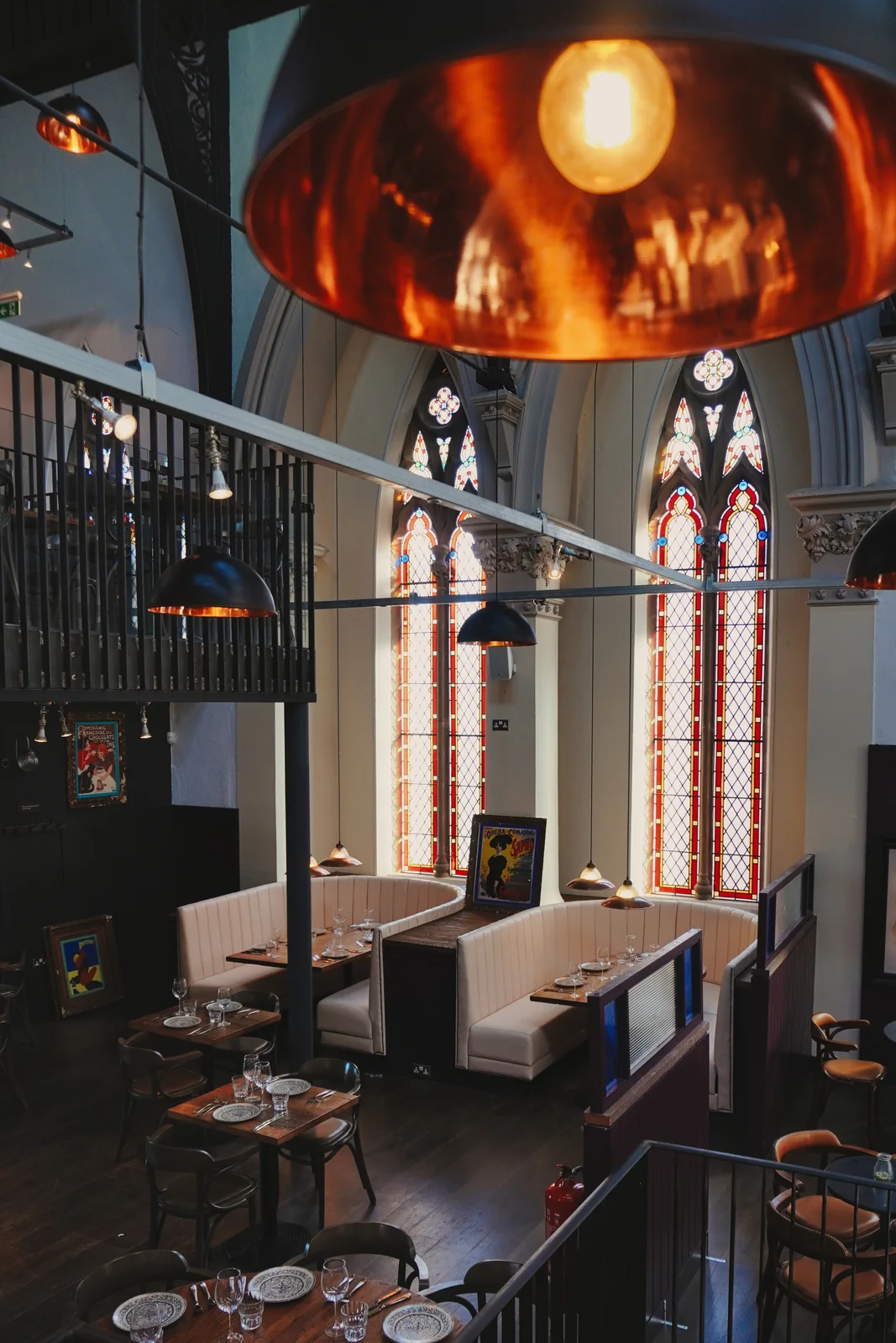 Copper pendant lights and stained-glass windows