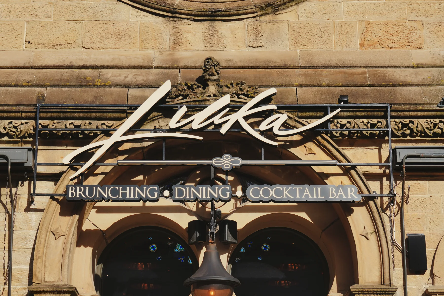 Lukaâ€™s sign above the stone entrance